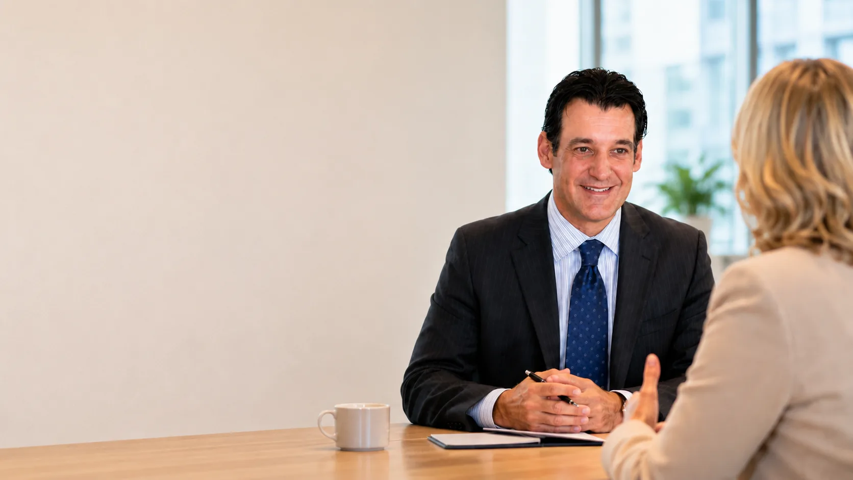 Dan Romano discussing commercial strategy priorities with a client